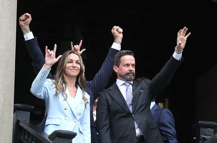 Karen Read celebrating acquittal verdict, raising hands with supporters outside courthouse after slaying cop boyfriend trial. Karen Read celebrating acquittal verdict, raising hands with supporters outside courthouse after slaying cop boyfriend trial.