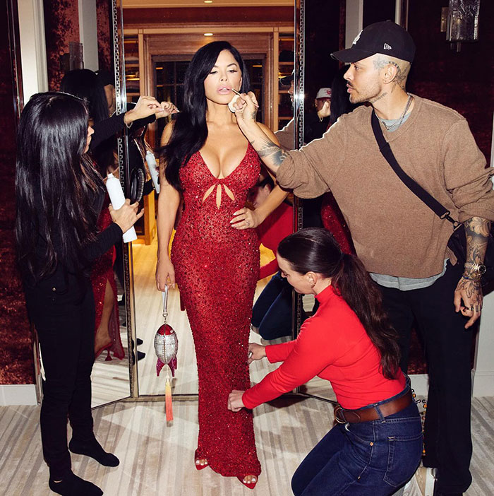 Lauren Sanchez in a red dress being styled by a team, highlighting the lavish wedding details causing mass fury. Lauren Sanchez in a red dress being styled by a team, highlighting the lavish wedding details causing mass fury.