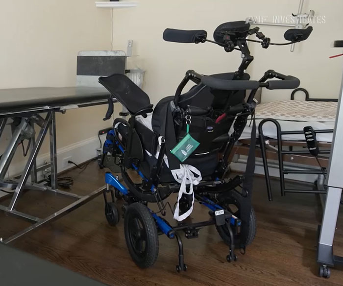 Motorized wheelchair in a room, highlighting the man stuck on a chair with locked-in syndrome after chiropractor visit. Motorized wheelchair in a room, highlighting the man stuck on a chair with locked-in syndrome after chiropractor visit.