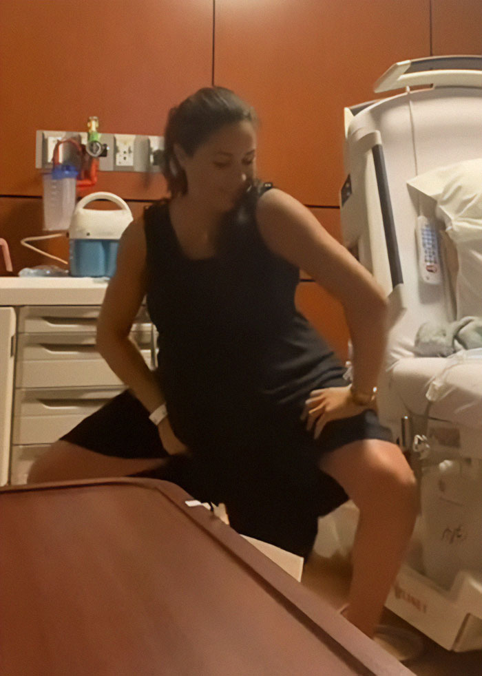 Pregnant woman in a black dress twerking in a hospital room, sparking Meghan Markle pregnancy conspiracy theories. Pregnant woman in a black dress twerking in a hospital room, sparking Meghan Markle pregnancy conspiracy theories.