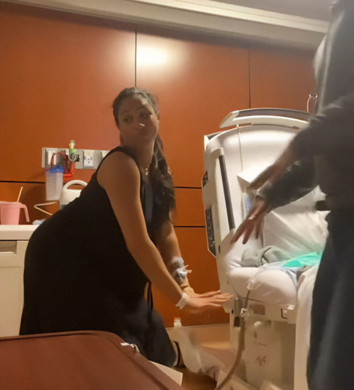 Pregnant woman twerking in hospital room, sparking Meghan Markle pregnancy conspiracy theory discussions. Pregnant woman twerking in hospital room, sparking Meghan Markle pregnancy conspiracy theory discussions.