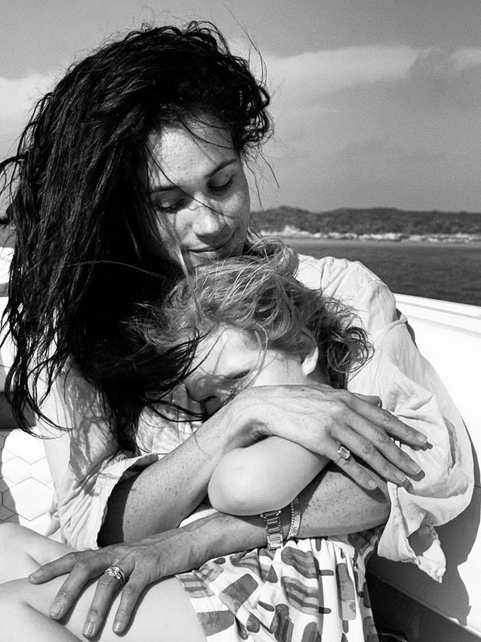 Meghan Markle holding child on boat, related to Meghan Markle twerking pregnancy video conspiracy theory. Meghan Markle holding child on boat, related to Meghan Markle twerking pregnancy video conspiracy theory.
