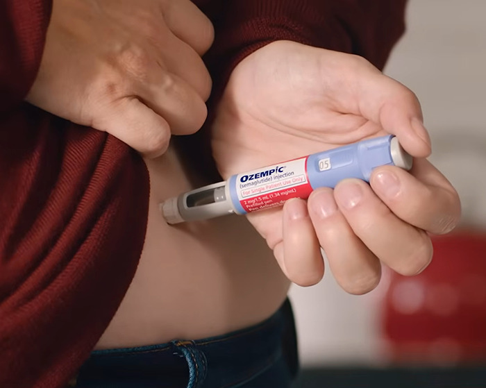 Person using Ozempic injection pen on abdomen, highlighting concerns about organ-damaging effects of Ozempic and Mounjaro. Person using Ozempic injection pen on abdomen, highlighting concerns about organ-damaging effects of Ozempic and Mounjaro.