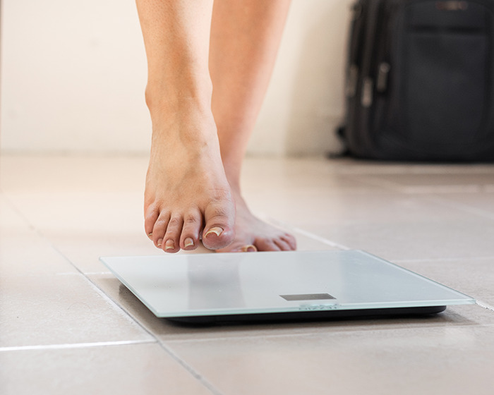 Person stepping on a digital scale, illustrating concerns related to organ-destroying effects of Ozempic and Mounjaro. Person stepping on a digital scale, illustrating concerns related to organ-destroying effects of Ozempic and Mounjaro.
