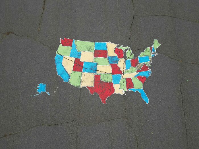 Map of the United States painted on pavement with states in different colors representing spelling challenge data. Map of the United States painted on pavement with states in different colors representing spelling challenge data.