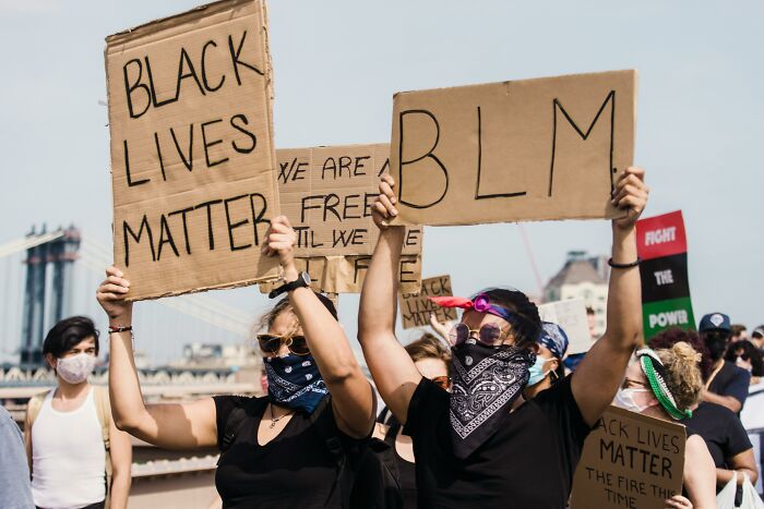Protesters holding Black Lives Matter signs during a demonstration sharing most privileged things said.
