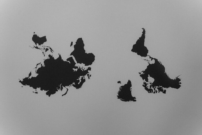 Black silhouettes of flipped countries shown side by side on a gray background for geography fans to identify. Black silhouettes of flipped countries shown side by side on a gray background for geography fans to identify.