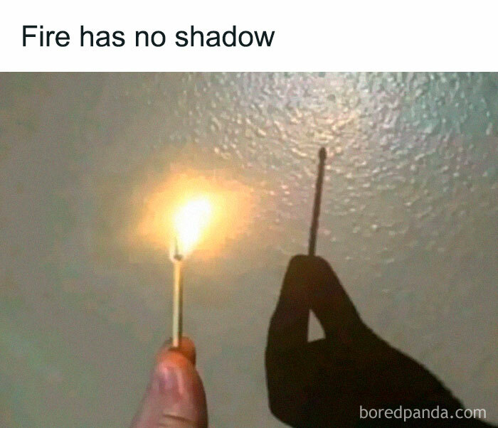 Hand holding a lit match showing a shadow without fire, illustrating a physics concept from physics is fun memes.