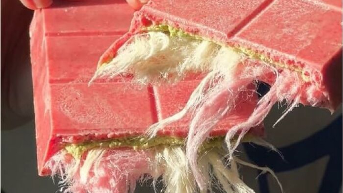 Pink candy bar with unusual cotton-like fibers inside, a bizarre find explaining why your bank account is giving you trouble