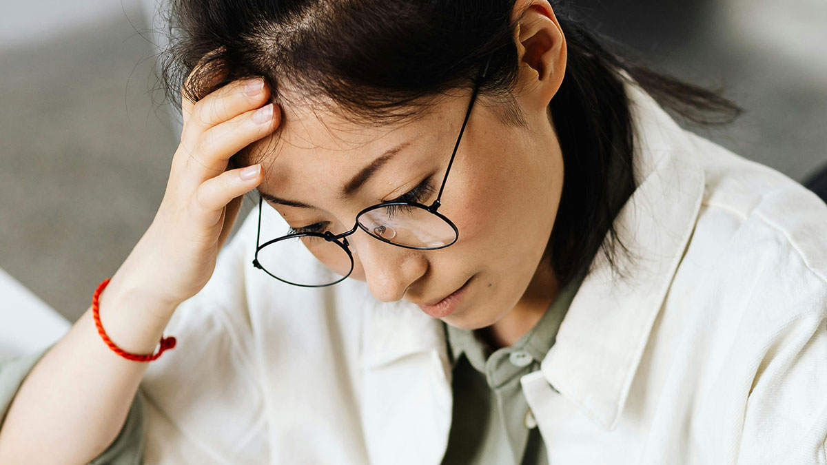 Woman looking distressed after finding out niece used college fund for prom without permission