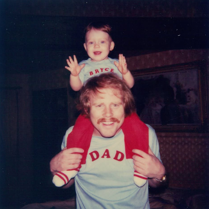 Childhood photo of Bryce Dallas Howard as a toddler on her father's shoulders highlighting her nepo baby background. Childhood photo of Bryce Dallas Howard as a toddler on her father's shoulders highlighting her nepo baby background.