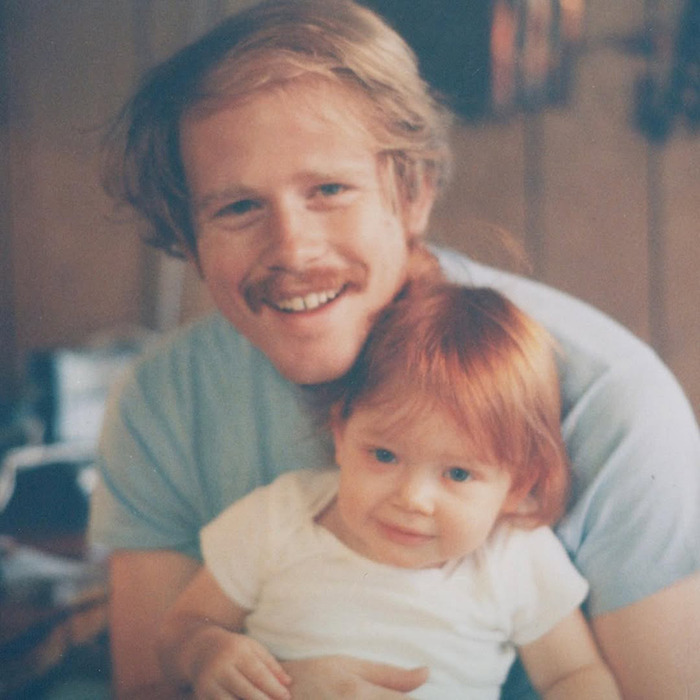 Vintage photo of a man and a child, representing Ron Howard’s nepo baby Bryce Dallas Howard's childhood moments. Vintage photo of a man and a child, representing Ron Howard’s nepo baby Bryce Dallas Howard's childhood moments.