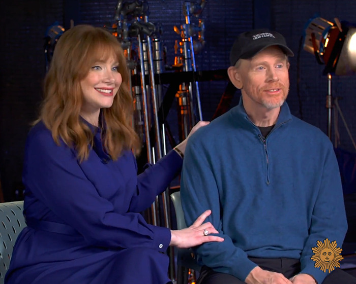 Bryce Dallas Howard and Ron Howard sitting together during an interview discussing her nepo baby childhood. Bryce Dallas Howard and Ron Howard sitting together during an interview discussing her nepo baby childhood.