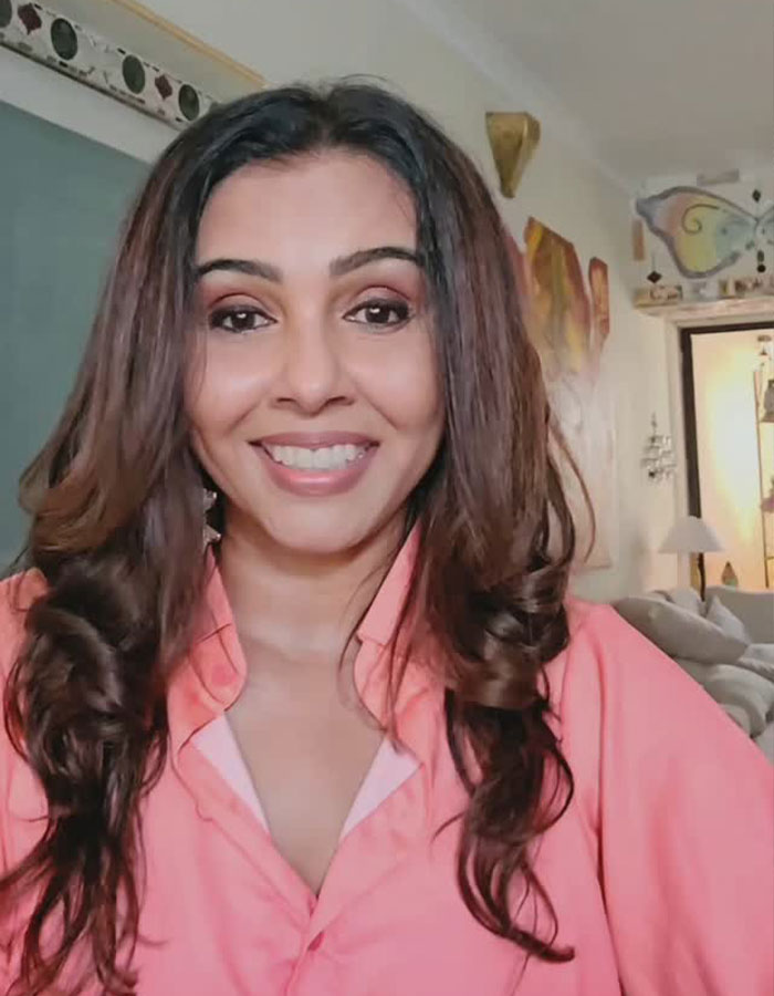 Actress smiling indoors, sparking outrage after accusing Air India crash miracle survivor of lying. Actress smiling indoors, sparking outrage after accusing Air India crash miracle survivor of lying.