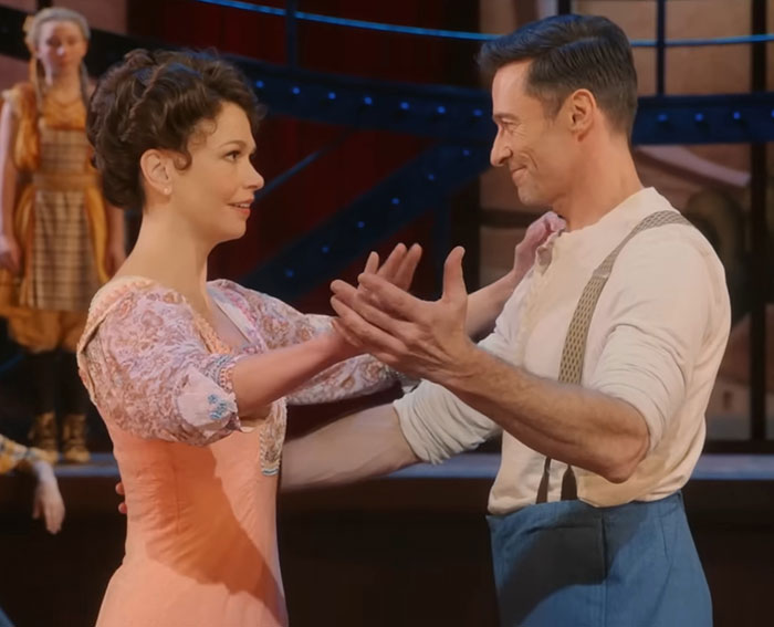 Hugh Jackman and Sutton Foster performing a dance scene, highlighting their 17-year history connection. Hugh Jackman and Sutton Foster performing a dance scene, highlighting their 17-year history connection.