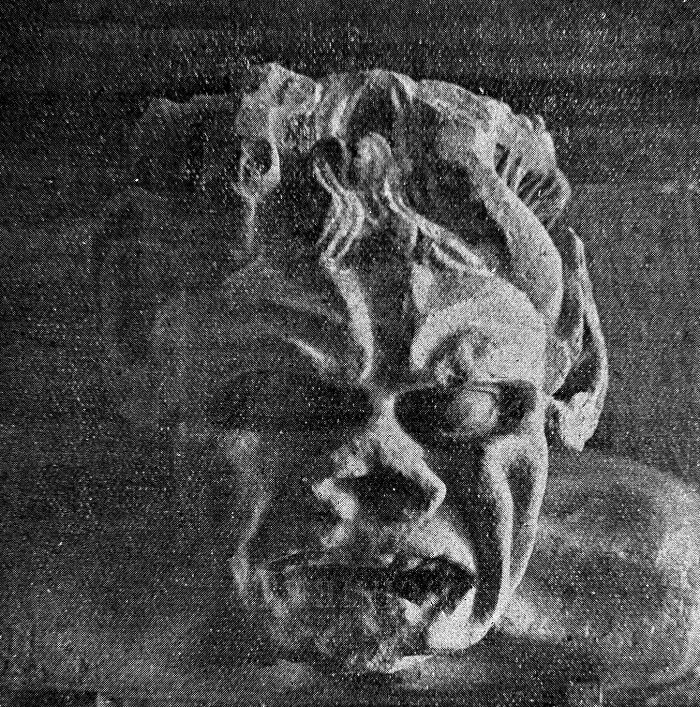 Disturbing close-up of a creepy distorted face sculpture from eerie and unsettling photos of the past.