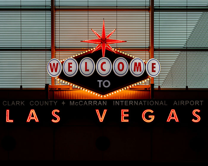 Welcome to Las Vegas neon sign at McCarran International Airport, symbolizing fun and nightlife in the city. Welcome to Las Vegas neon sign at McCarran International Airport, symbolizing fun and nightlife in the city.