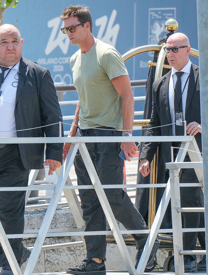 Celebrity walking with security, showing strung-out looks after weekend partying at Jeff Bezos and Lauren Sánchez wedding. Celebrity walking with security, showing strung-out looks after weekend partying at Jeff Bezos and Lauren Sánchez wedding.