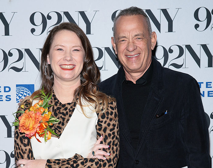 Tom Hanks smiling with daughter at 92NY event, addressing family confusion and childhood violence concerns. Tom Hanks smiling with daughter at 92NY event, addressing family confusion and childhood violence concerns.
