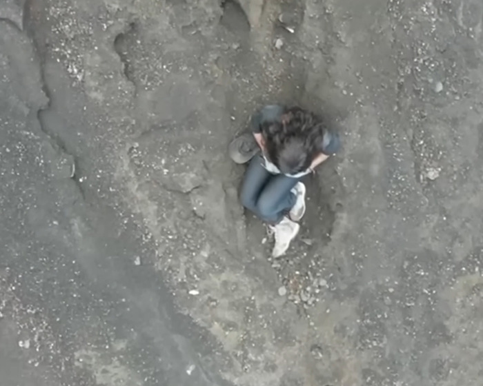 Tourist abandoned in active volcano sitting on rocky ground, viewed from above, sparking outrage and viral attention. Tourist abandoned in active volcano sitting on rocky ground, viewed from above, sparking outrage and viral attention.