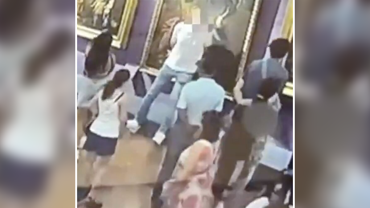 Crowd in an Italian museum watching a tourist accidentally rip a hole in an 18th century painting while taking a selfie.