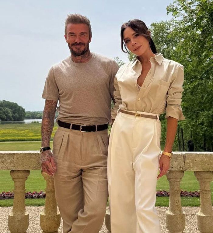 David and Victoria Beckham posing outdoors in neutral tones amid Brooklyn Beckham family no contact feud. David and Victoria Beckham posing outdoors in neutral tones amid Brooklyn Beckham family no contact feud.