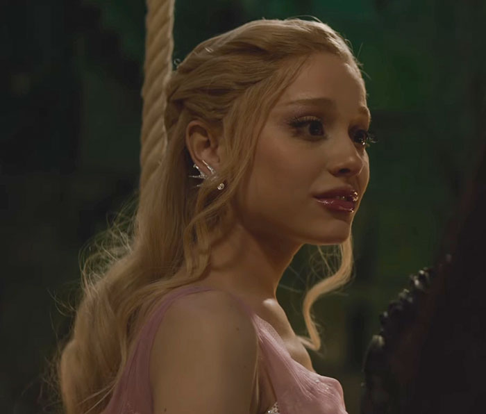 Ariana Grande with long blonde hair and ghoulish makeup, highlighting entirely visible ribcage in Wicked trailer scene. Ariana Grande with long blonde hair and ghoulish makeup, highlighting entirely visible ribcage in Wicked trailer scene.