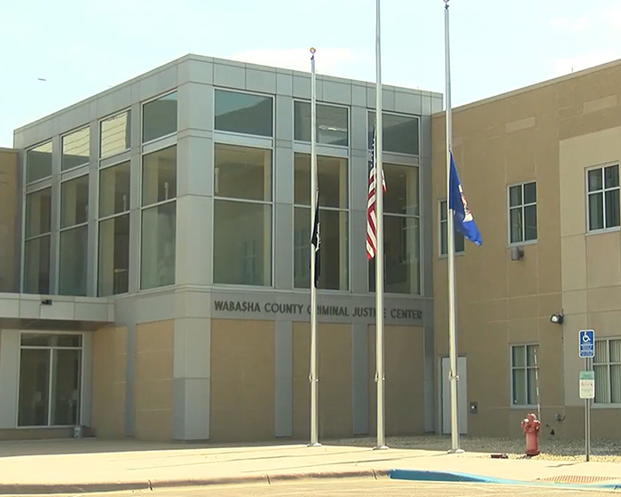 Wabasha County Criminal Justice Center with flags outside, related to caring mother with portion of jaw missing case. Wabasha County Criminal Justice Center with flags outside, related to caring mother with portion of jaw missing case.