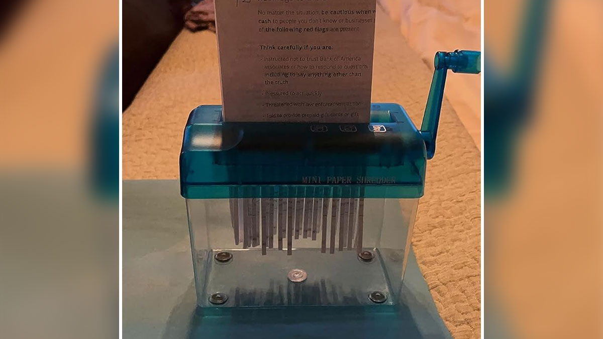 Mini paper shredder on a table illustrating unusual office items that impact your soul-crushing job experience.