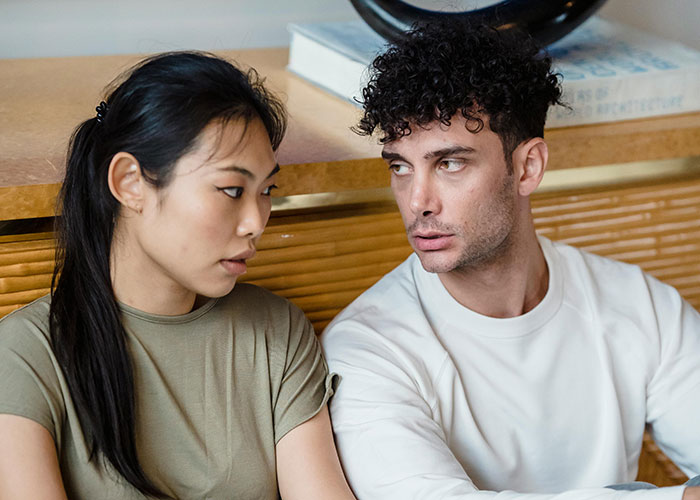 Woman rethinks her relationship after a red-flag argument with boyfriend, showing fear and concern during tense conversation. Woman rethinks her relationship after a red-flag argument with boyfriend, showing fear and concern during tense conversation.
