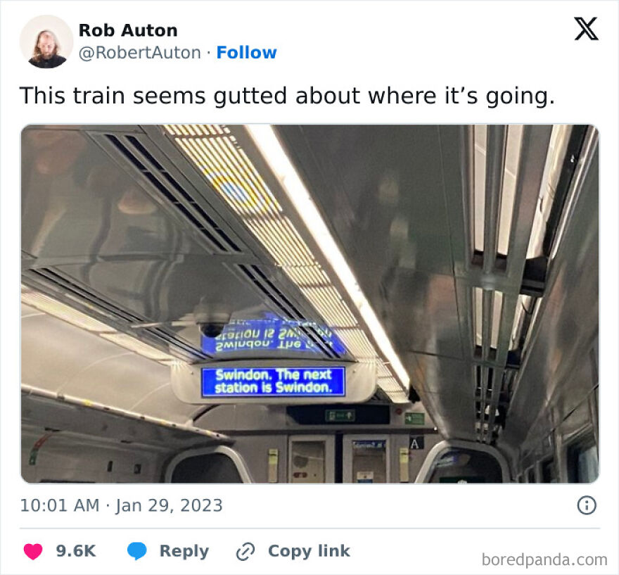 Train interior with a digital sign showing Swindon as the next station, capturing British humor in daily memes.