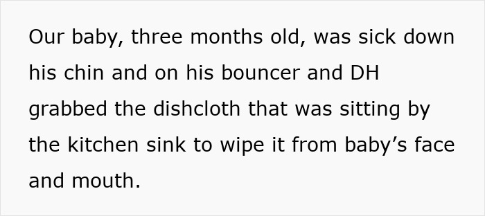 Husband carrying infant by the arms while wiping baby’s face with a dishrag in a home setting. Husband carrying infant by the arms while wiping baby’s face with a dishrag in a home setting.
