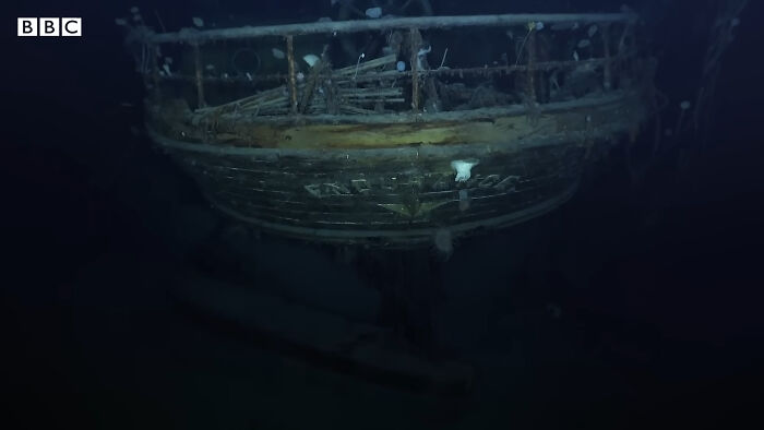 Underwater view of a sunken historical shipwreck illustrating crazy but real historical events beneath the ocean.