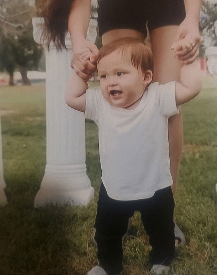 Toddler taking first steps outdoors with adult support, related to baby lost life in car and tougher court charges.