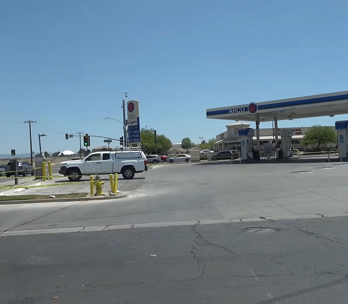 ARCO gas station outside view with parked trucks and clear sky where teddy bear covered in human remains was found ARCO gas station outside view with parked trucks and clear sky where teddy bear covered in human remains was found