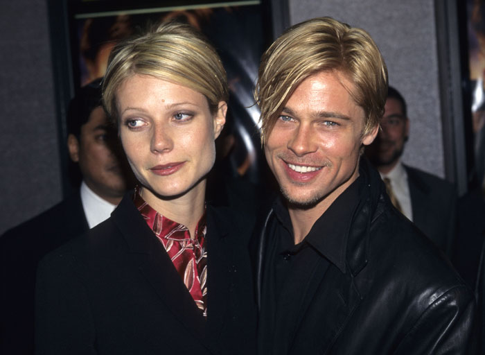 Gwyneth Paltrow and Brad Pitt smiling together at an event, highlighting Gwyneth Paltrow under fire during their relationship. Gwyneth Paltrow and Brad Pitt smiling together at an event, highlighting Gwyneth Paltrow under fire during their relationship.