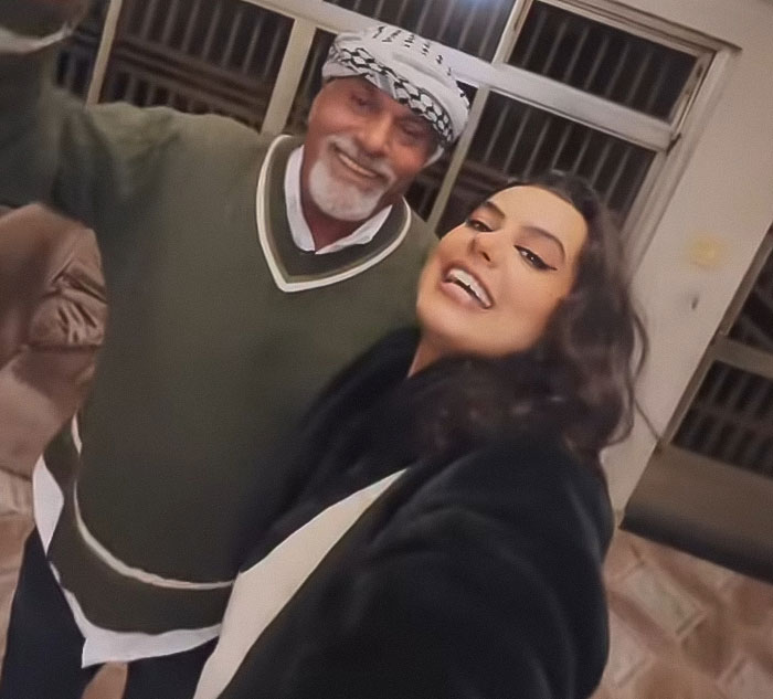 Woman smiling with older man inside family home during emotional visit 46 years after dad left, capturing stunning reunion moment. Woman smiling with older man inside family home during emotional visit 46 years after dad left, capturing stunning reunion moment.