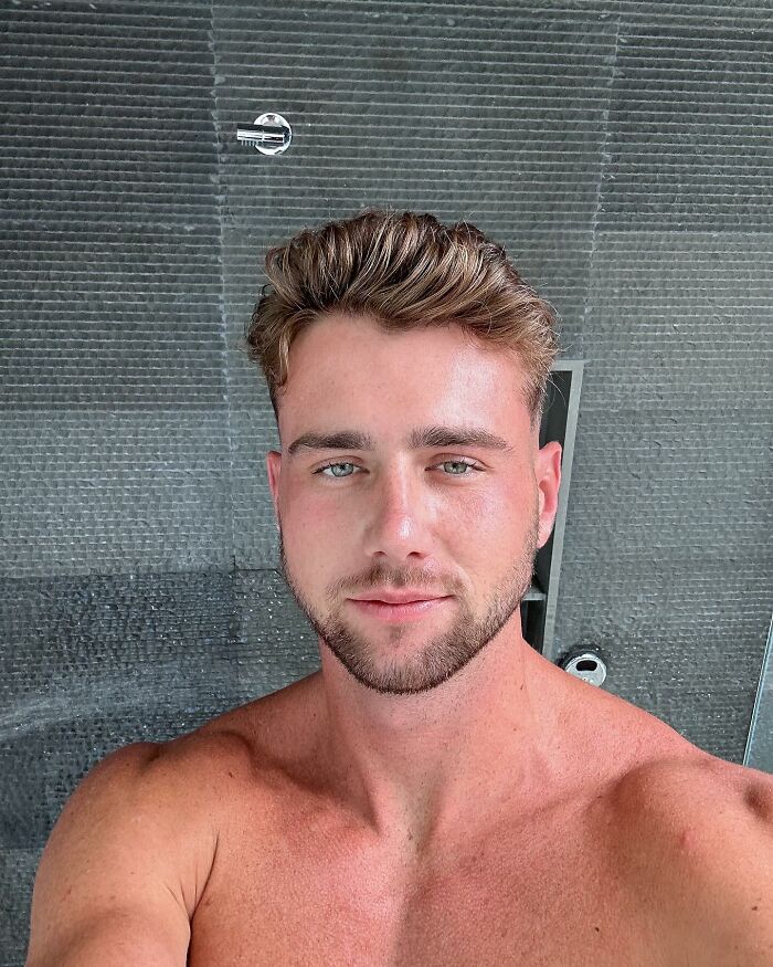 Young shirtless man with styled hair and beard taking a selfie in a modern bathroom, related to Netflix and Aussie star email. Young shirtless man with styled hair and beard taking a selfie in a modern bathroom, related to Netflix and Aussie star email.