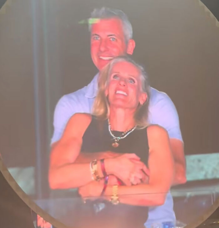 Couple embracing and smiling, related to Coldplay HR exec mortgage controversy and financial issues. Couple embracing and smiling, related to Coldplay HR exec mortgage controversy and financial issues.