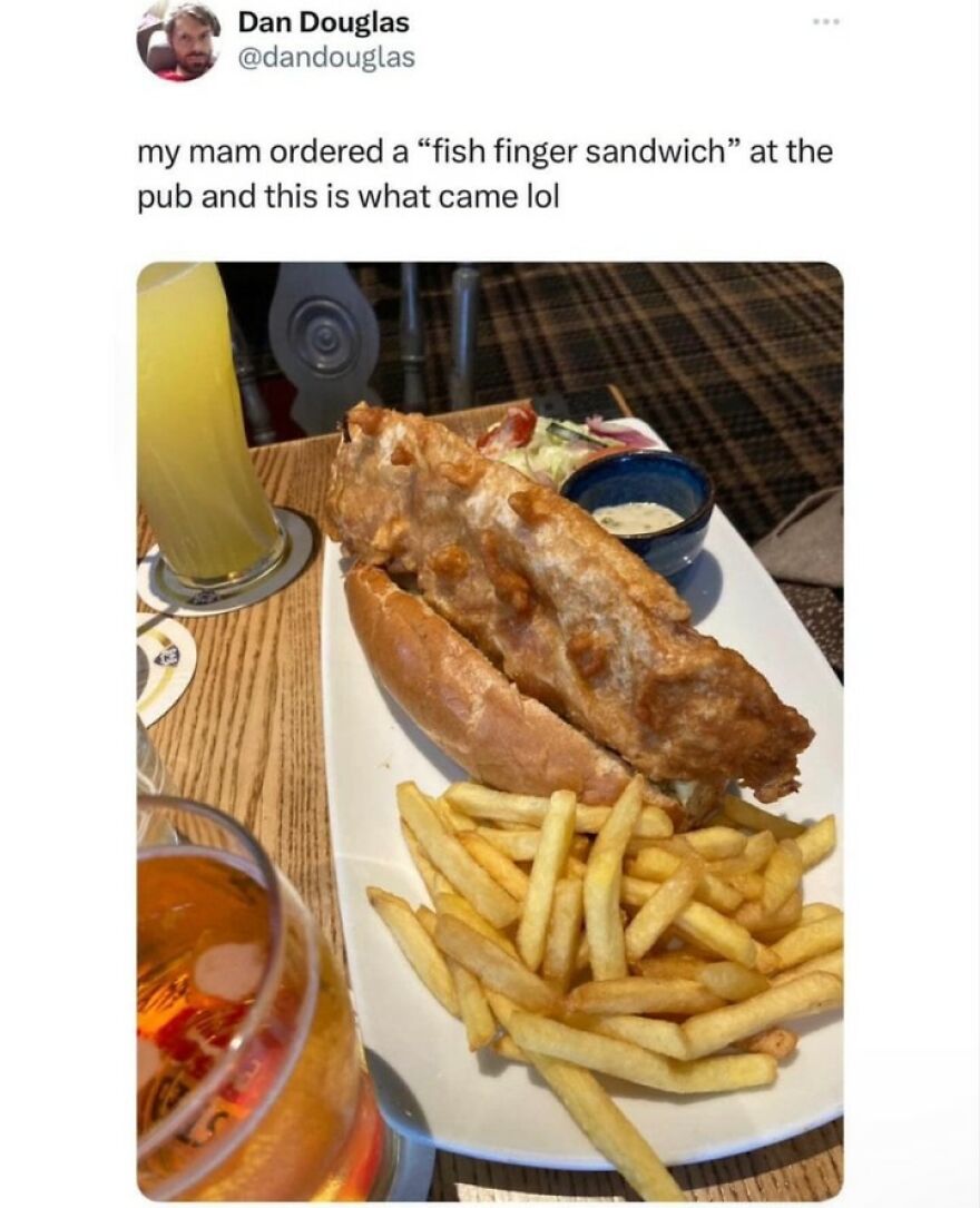 A humorous British meme showing a fish finger sandwich with fries at a pub for daily dose of British humor.