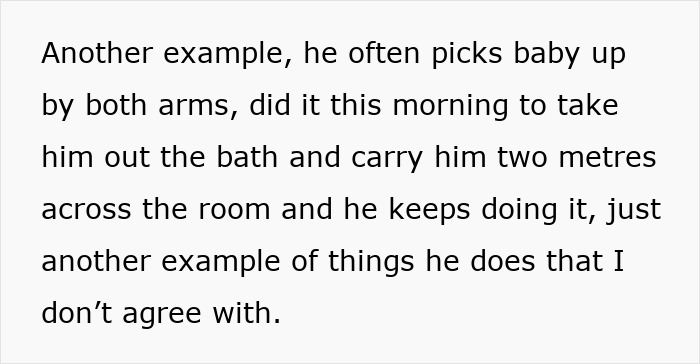 Husband carries infant by the arms and wipes face with dishrags while wife expresses concern about it. Husband carries infant by the arms and wipes face with dishrags while wife expresses concern about it.
