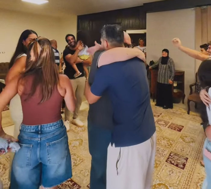 Family reunion in a home after 46 years, capturing emotional moments as the woman visits her childhood family house. Family reunion in a home after 46 years, capturing emotional moments as the woman visits her childhood family house.