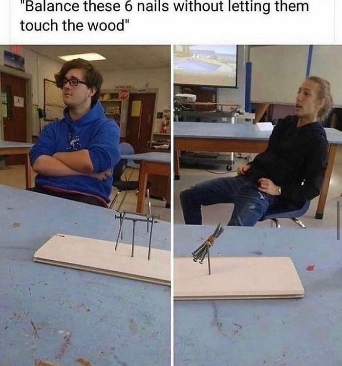Two students in a classroom balancing nails on a board demonstrating weird and unhinged humor memes.