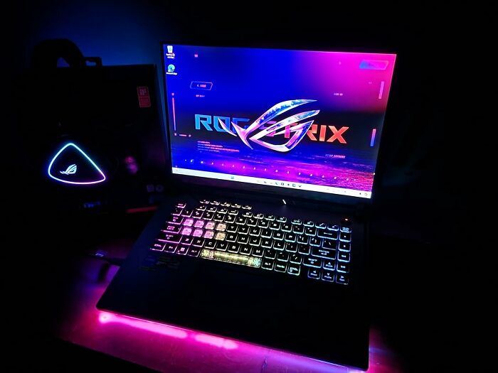 Gaming laptop with colorful RGB keyboard and neon lighting showcasing electronic deals for Prime Day shoppers.