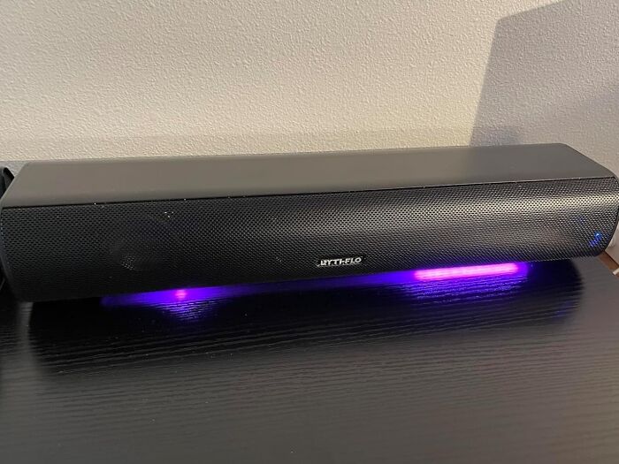 Black MYTH-FLO soundbar with purple LED lighting underneath, showcasing Prime Day electronic deals for tech lovers.