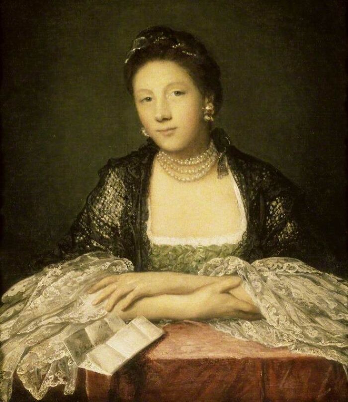 Portrait of a historical courtesan dressed in elegant lace and pearls, representing power players in history.