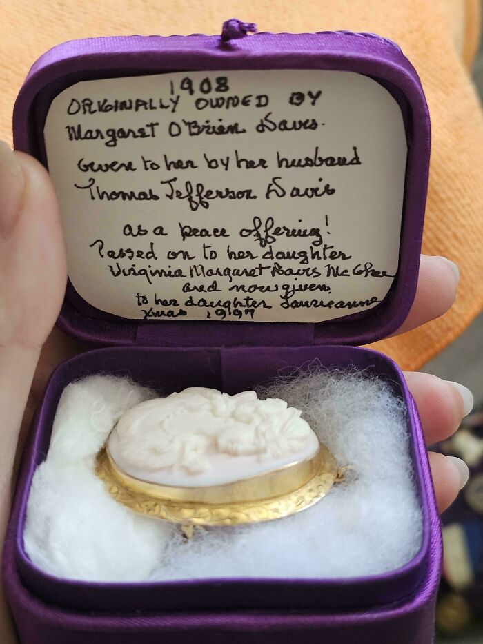 Vintage carved cameo brooch in a purple velvet box, a beautiful old thing cherished across generations.