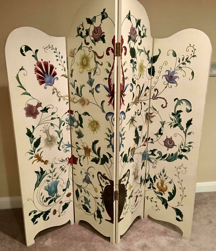 Hand-painted vintage folding screen with colorful floral designs, a beautiful old item owned by collectors.