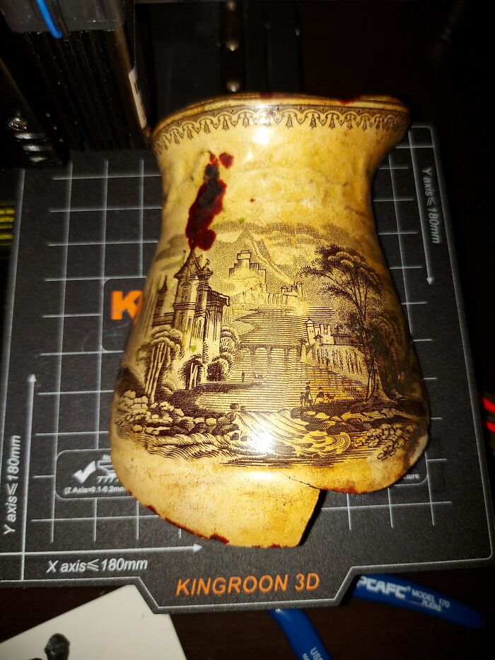 Antique ceramic piece with intricate landscape design, showcasing one of the most interesting and beautiful old things owned.