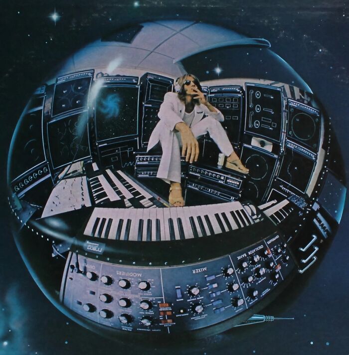 1970s rock legend in a vintage studio surrounded by keyboards and synthesizers creating iconic music.